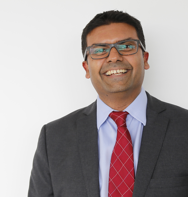 Ahmed Ahmed photo wearing scrubs