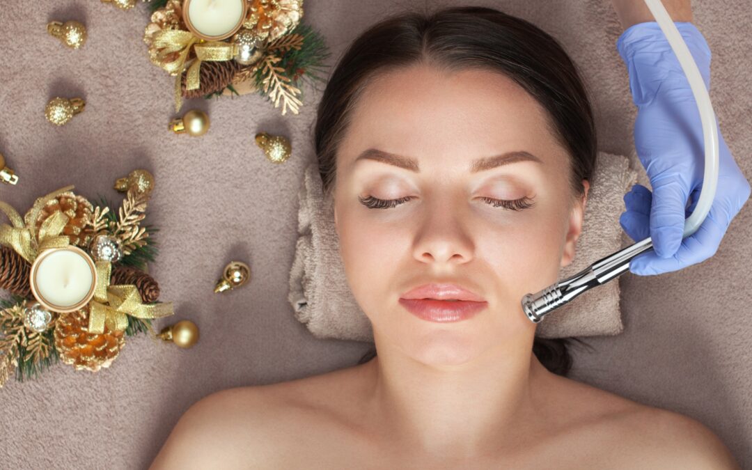 Beautician giving a facial procedure next to Christmas decorations