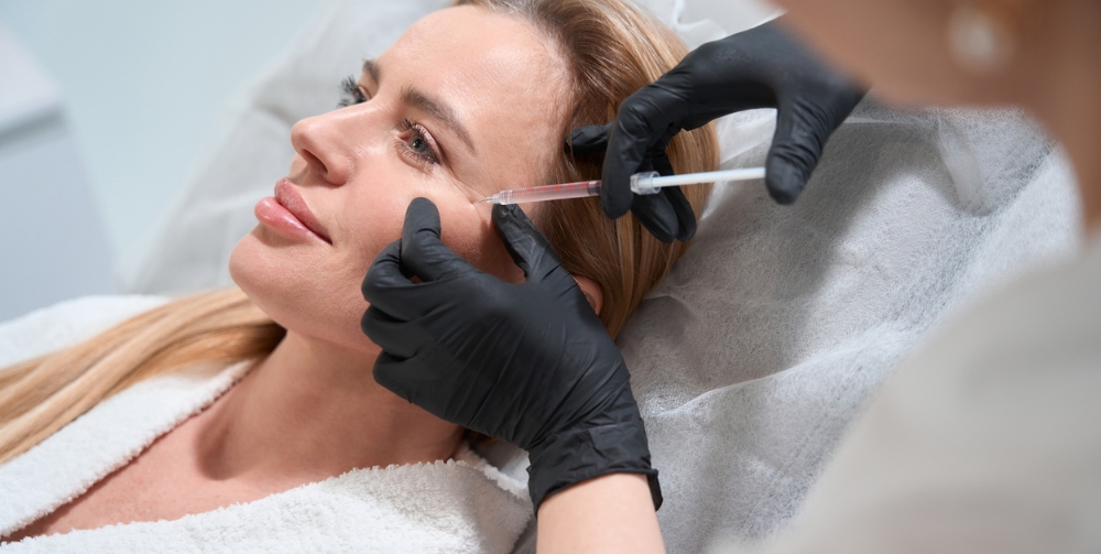 Female getting a rejuvenating injection in her cheeks