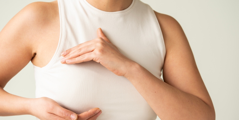 woman touching breasts